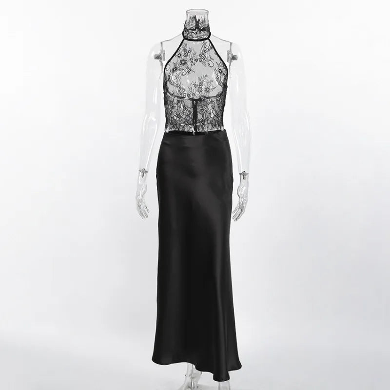 Black evening gown with floral lace top on a mannequin against a white background