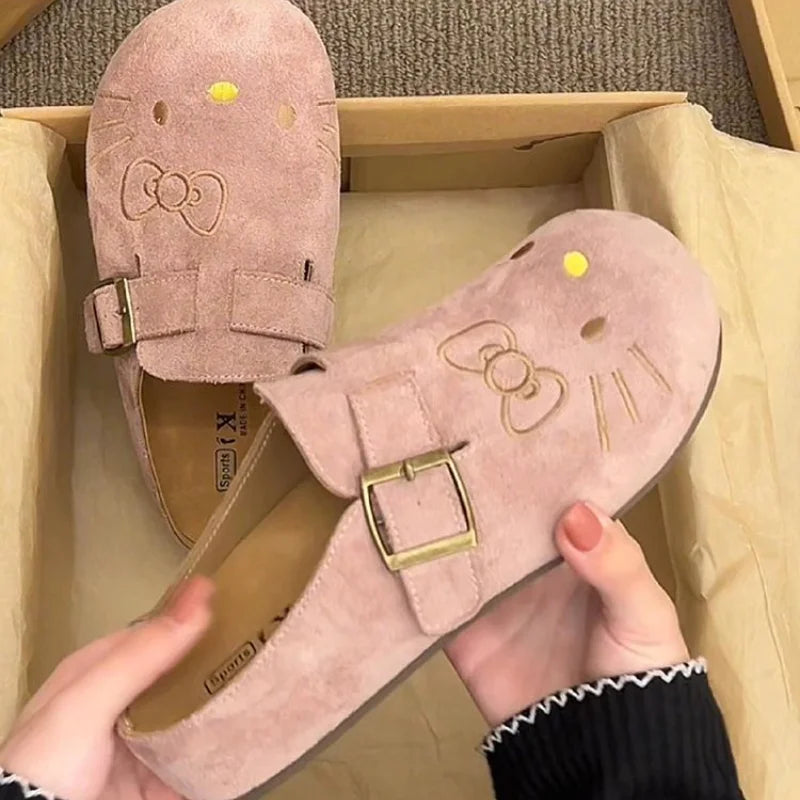Pink suede Hello Kitty buckle mules