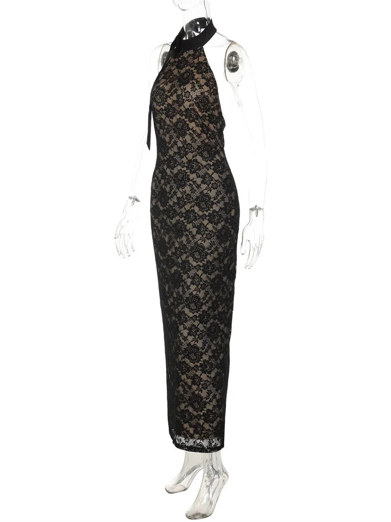 Black lace dress on a mannequin against a white background