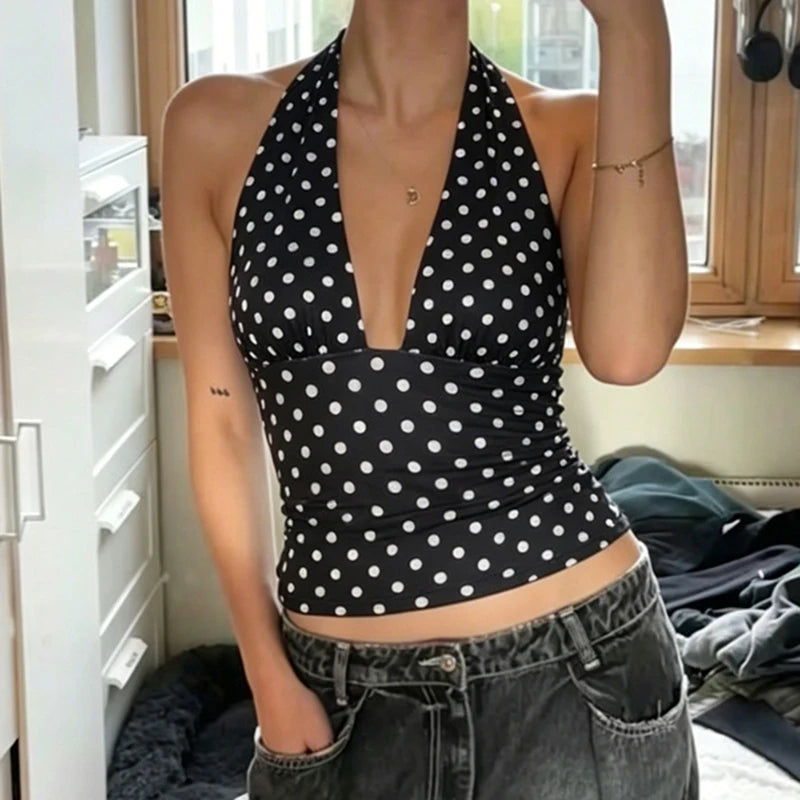 Black and white polka dot halter neck cropped top from behind