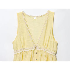 Yellow sleeveless dress with lace details on a white background