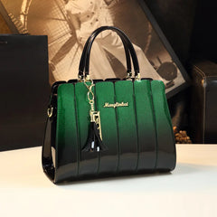 Close-up of a glossy leather satchel handbag, highlighting the gold-tone hardware and luxurious texture. Green 3