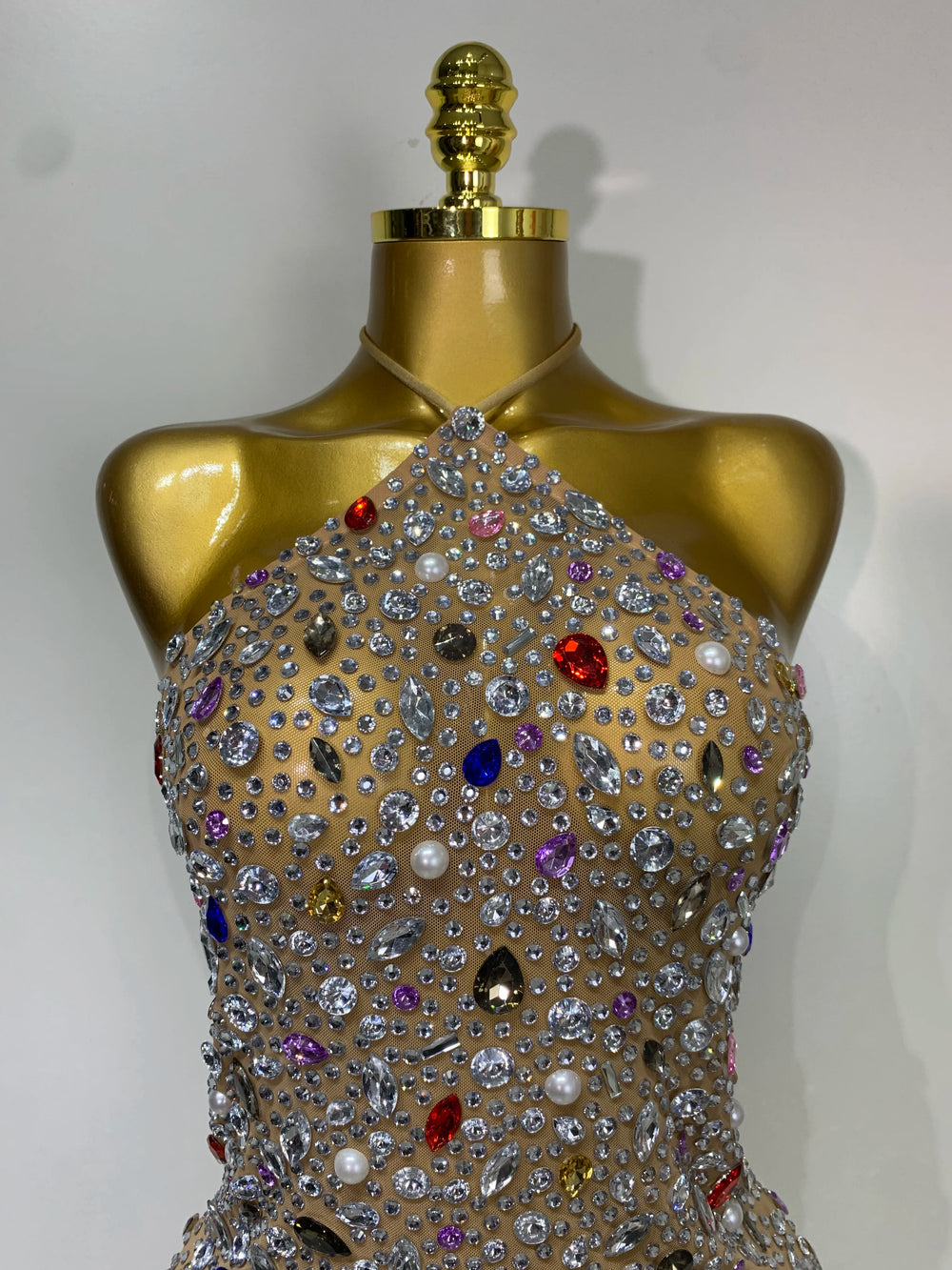 Close-up of halter neck crystal embellished mesh dress bodice