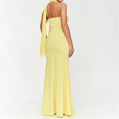 Yellow halter neck gown on a white background