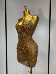 Side view of gold embellished sheer mini dress