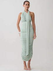 Back view of sage green halter neck ruched midi dress