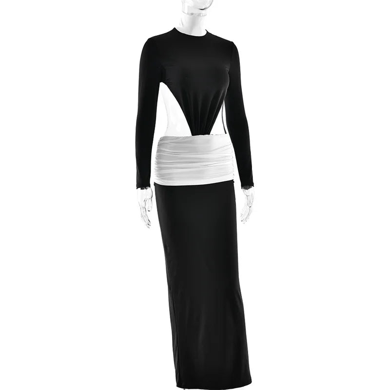 Mannequin wearing a black and white dress with a long skirt on a white background