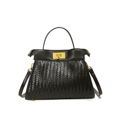 Black woven handbag with gold accents 