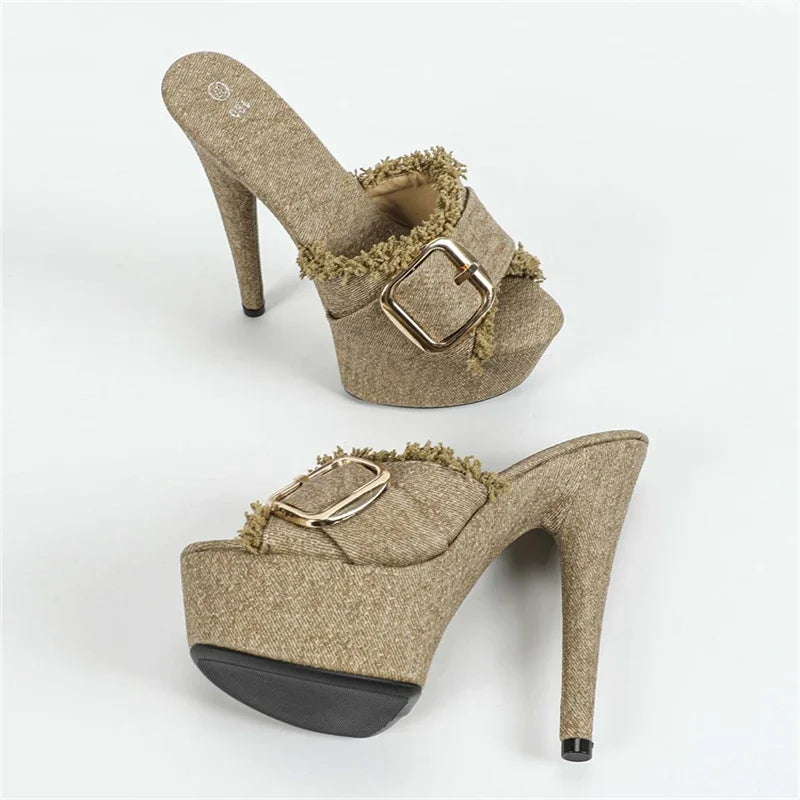 Pair of gold high-heeled shoes with a buckle on a white background