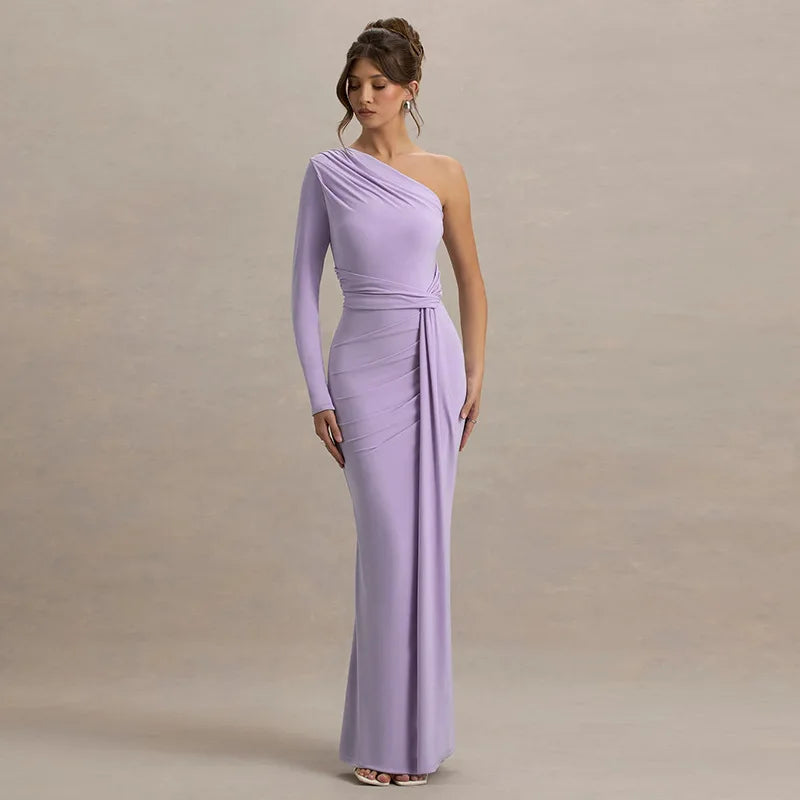 Woman wearing a one-shoulder lavender gown against a beige background