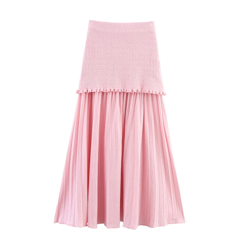 Pink skirt with textured top and pleated skirt on a white background