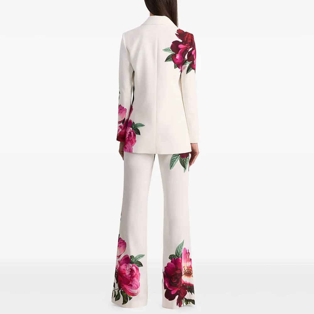 Floral print blazer and flare pants suit on a model, back view.