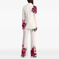 Floral print blazer and flare pants suit on a model, back view.
