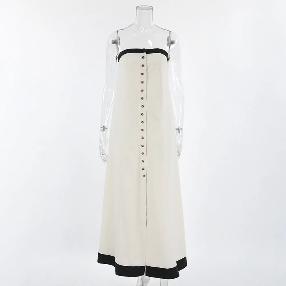 White dress with black trim on a mannequin- front view