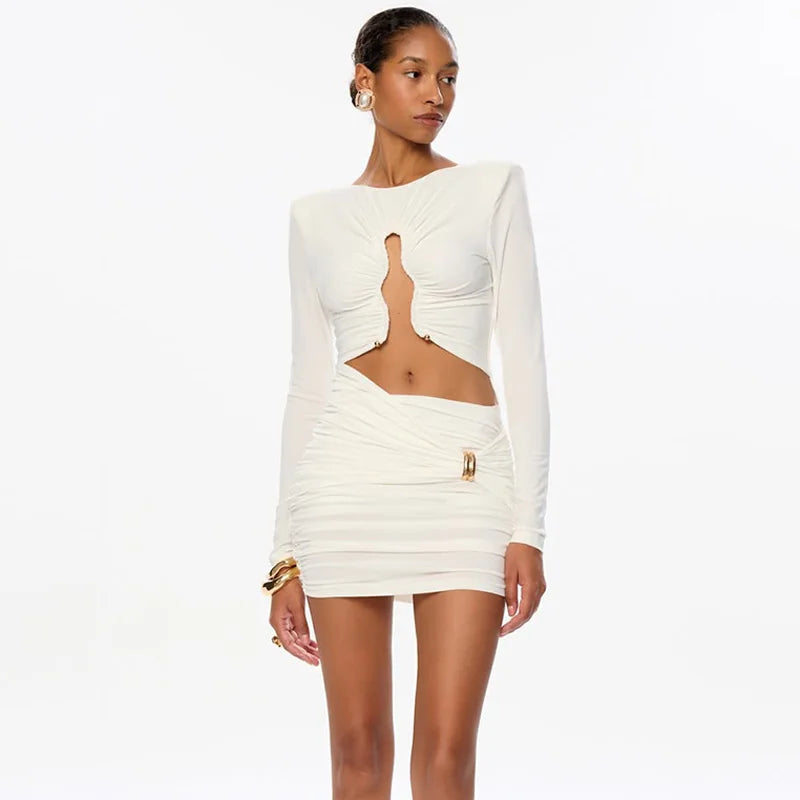 Woman wearing a white dress with cut-out design on a white background