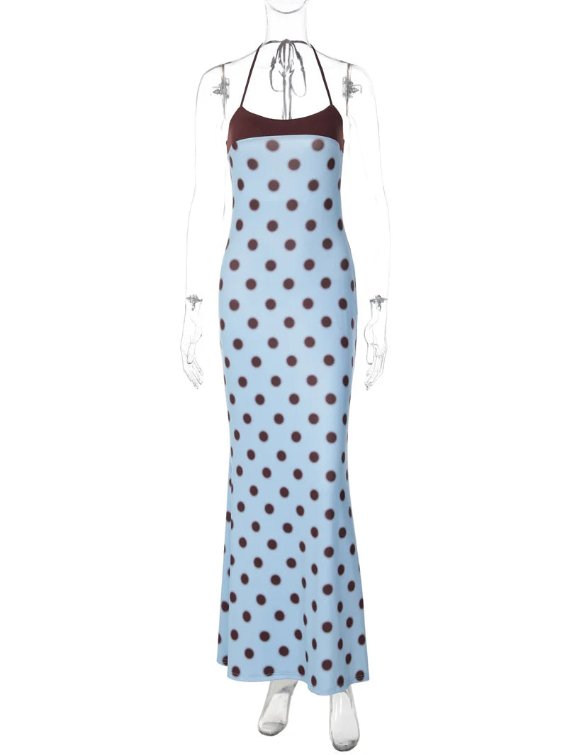 Blue dress with brown polka dots on a mannequin against a white background