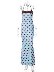 Blue dress with brown polka dots on a mannequin against a white background
