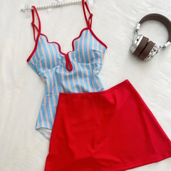 Blue striped bikini top with red trim and red skirt