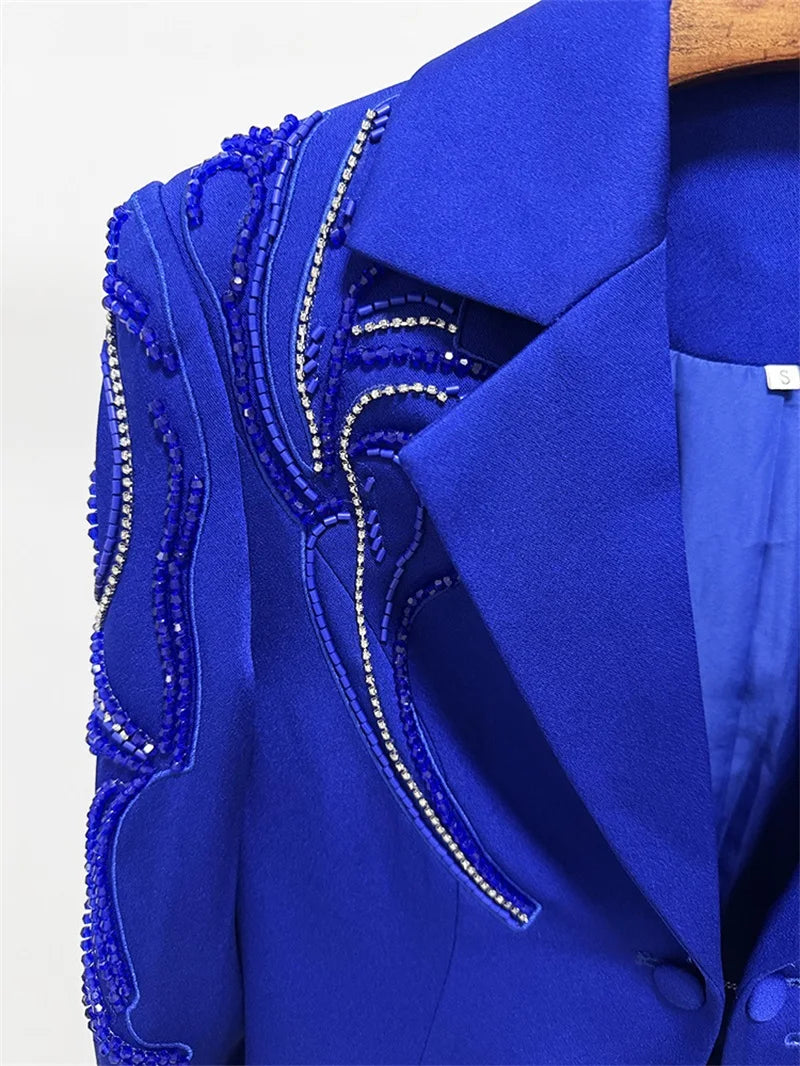 Close-up of beaded crystal embellishments on blazer