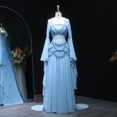 Light blue evening gown on a mannequin against a dark background