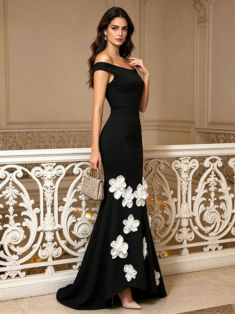Black off-shoulder maxi dress with 3D floral appliqués from side