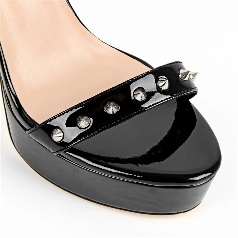 Black platform shoe with studded detail on a white background