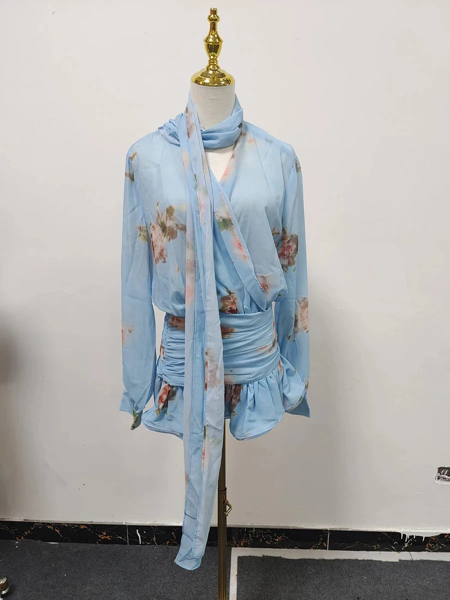 Light blue floral dress on a mannequin against a white background