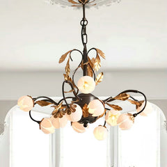 Antique black chandelier with 12 lights and pink tulip-shaped lamp shades, hanging from a ceiling. Golden Atelier 2