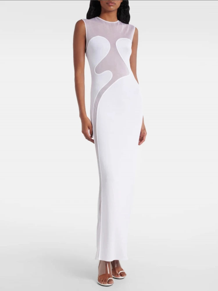 Woman wearing a white and gray dress on a white background