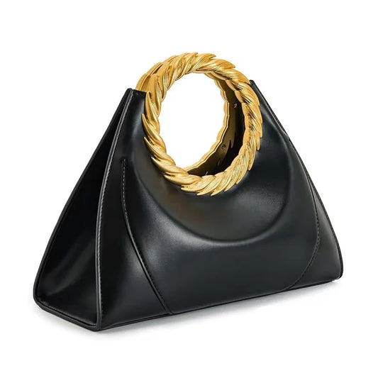 Black faux leather top handle bag with a gold braided ring handle