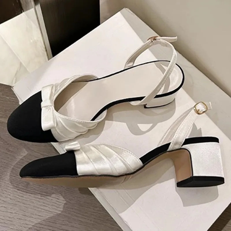 White bow slingback mid heel pumps side view