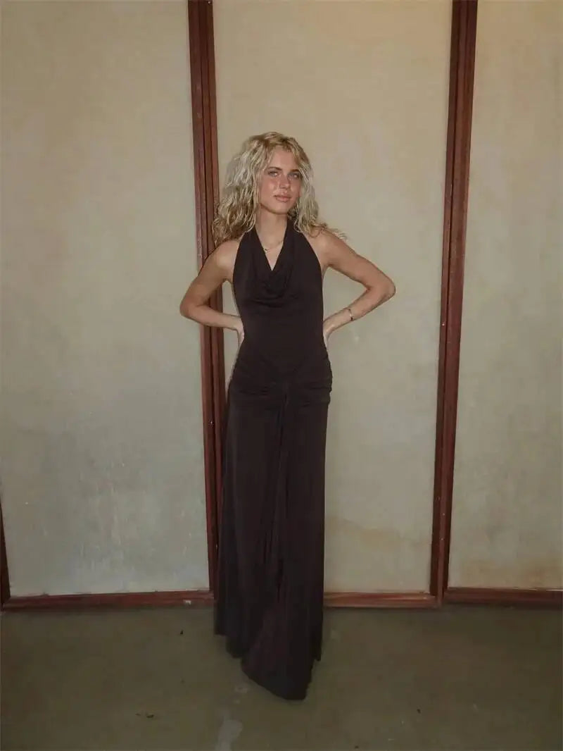 Brown halter neck draped maxi dress against a neutral background