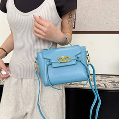 Light blue structured top handle bag with gold hardware