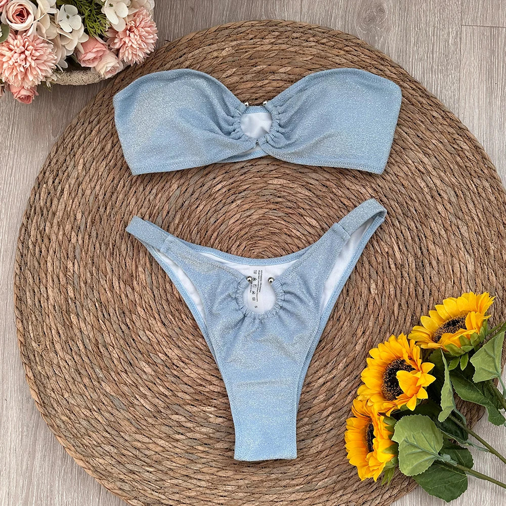 Sparkling bandeau bikini swimwear set laid flat