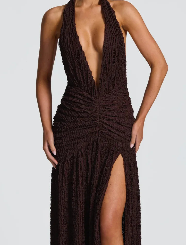 Brown halter neck dress with a deep neckline and high slit