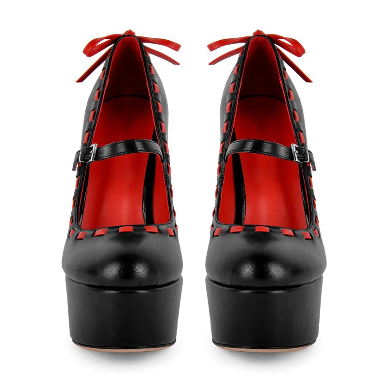 Front view of black platform Mary Jane stiletto heels with red contrast stitching