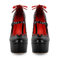 Front view of black platform Mary Jane stiletto heels with red contrast stitching