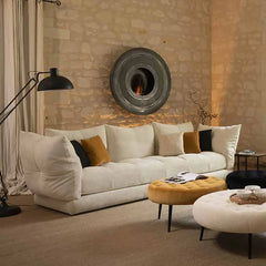 Minimalist white sofa in stone wall living room with arc design and warm lighting