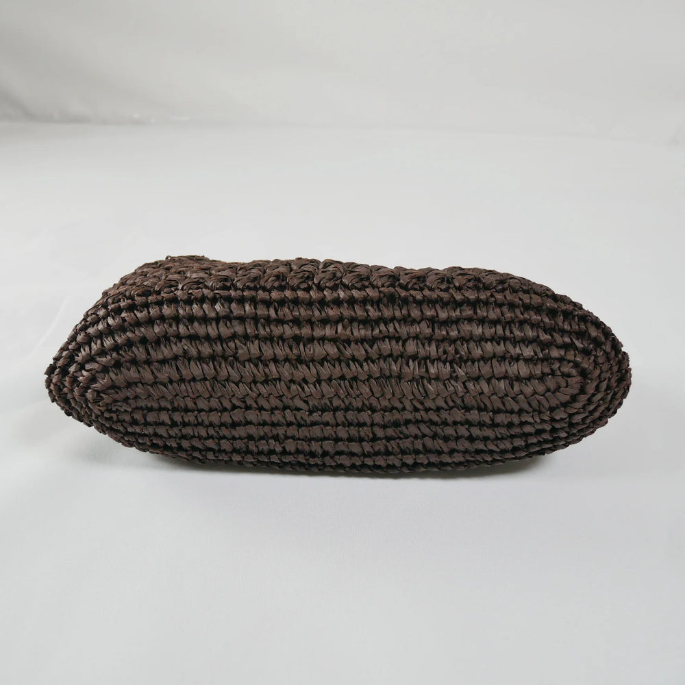 Coffee woven oval pillow on a white background