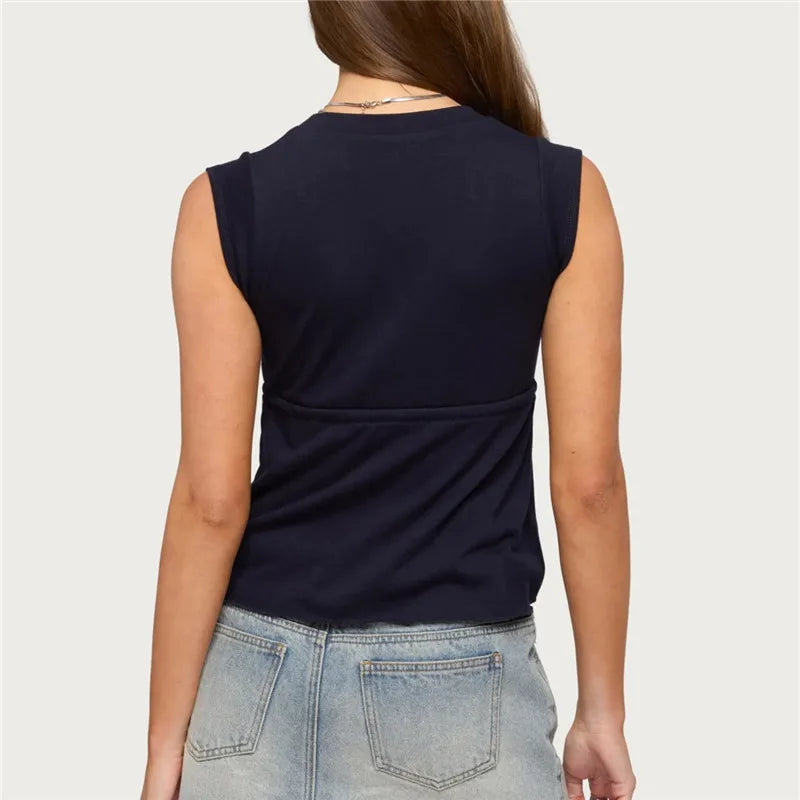 Back view of sleeveless wrap front top with tie waist and peplum hem