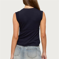 Back view of sleeveless wrap front top with tie waist and peplum hem