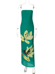 Green strapless dress with yellow floral patterns on a mannequin against a white background
