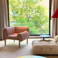 Italian style lounge chair with textured fabric upholstery