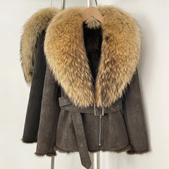 Detail of the belt buckle and zipper closure on the suede fur jacket.
