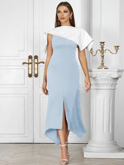 Woman wearing a light blue and white dress in an elegant interior setting.