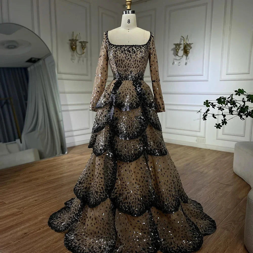 Black beaded tiered tulle evening gown with full sleeves and square neckline