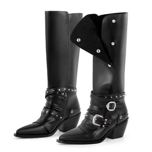 Pointed toe black knee high boots with wrap around straps and metal buckles.