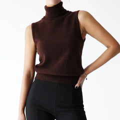 Brown sleeveless turtleneck sweater worn by a person on a white background