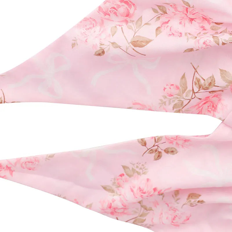Pink floral fabric with roses and leaves 