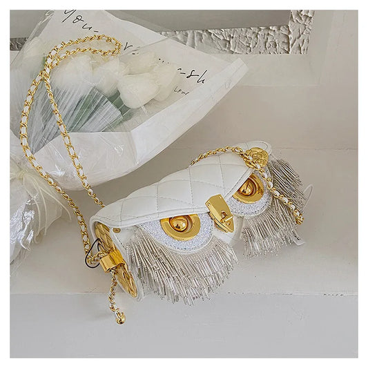 White quilted owl chain bag with fringe detail